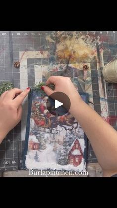 someone is making christmas cards with scissors