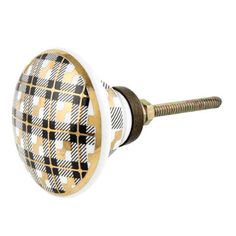 a black and white checkered door knob with gold accents on it's side