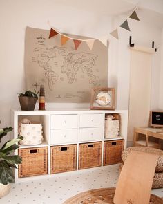 a living room with baskets and a map on the wall