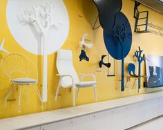 the wall is decorated with different types of furniture