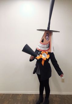 a person in a costume with a baseball bat on their head and a hat on his head