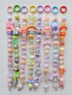 many different kinds of charms on a white surface