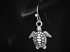 For other TURTLE jewellery in my shop please click here : https://etsy.me/3j3lDN1 All my earrings are sold as a PAIR, but if you would like just a single earring, I am happy to mix and match a pair for you. I have over 300 different earrings available in a choice of Clip on or various metals and styles for pierced ears. Please click here to see the whole selection : https://etsy.me/3gTR5fd If you can't find what you're looking for, please send me a message as I have lots more available that I haven't added to my Etsy Shop yet. CHARM : 17mm x 13mm Tibetan Silver (Antique Silver Coloured Metal Alloy - Lead & Nickel Free) STYLE: Large selection to choose from. Please see photo for details and select from the drop down menu. PACKAGING : Presented on a handmade presentation card and sealed in a Turtle Jewelry, Presentation Cards, Handmade Gift Tags, Turtle Earrings, Single Earring, Stainless Steel Jewelry, Pierced Ears, Sea Turtle, Clip On