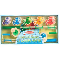 an assortment of wooden fishing toys in a cardboard box with instructions on how to use them