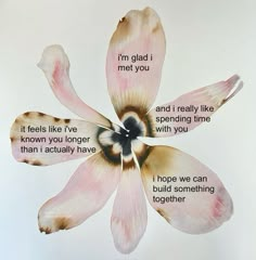 a flower with some words written on it