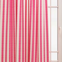 pink and white striped curtains in front of a window