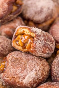 powdered sugar covered pastries are piled on top of each other in a pile