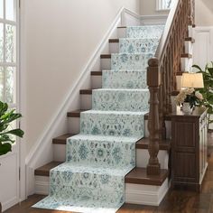 a stair case with blue flowers on it