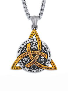 a yellow and black necklace with an intricate design on the front, surrounded by celtic symbols