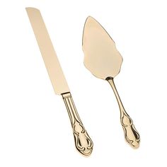 two gold colored utensils sitting next to each other