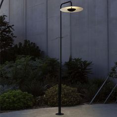 an outdoor lamp on the side of a building