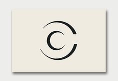 the letter c is shown in black on a white square paper with an oval shape