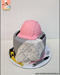 there is a cake with construction hats on it