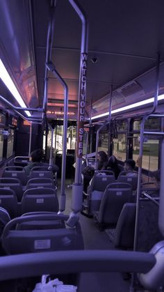 the interior of a public transit bus at night