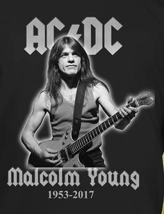 a black shirt with an image of a man holding a guitar and the words ac / dc