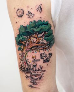 a person with a tree tattoo on their arm