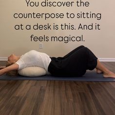 a woman is laying on her back on a yoga mat with the words, you discovery the counterpose to sitting at a desk is this and it feels magic