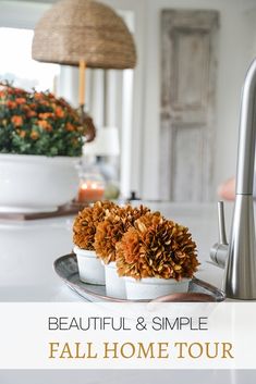 beautiful and simple fall home tour with flowers in white dishes on the kitchen countertop