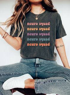 "Comfort Colors Neuro Squad T-shirt, Neuro Nursing Shirt, Nursing T-shirt,  Neuro CNA Tee, Personalized T-shirt, Custom Nurse Gift https://toptrendtshirtsus.etsy.com NOTE: Please contact me for more size,color, product (sweatshirt, hoodies,kids etc) options. I'm always here to help. Unisex Garment-Dyed T-shirt Comfort Colors® 1717 *Medium fabric (6.1 oz/yd² (206.8 g/m *Relaxed fit *Sewn-in twill label *100% ring-spun cotton About Comfort Colors introduces its garment-dyed t-shirt; a fully custom Multicolor Cotton T-shirt With Funny Text, Multicolor Band Merch T-shirt With Letter Print, Multicolor Slogan T-shirt With Short Sleeves, Multicolor Short Sleeve T-shirt With Slogan, Multicolor Crew Neck T-shirt With Letter Print, Multicolor Graphic Tee With Slogan, Multicolor Letter Print Crew Neck T-shirt, Multicolor Slogan T-shirt, Multicolor Slogan Graphic Tee