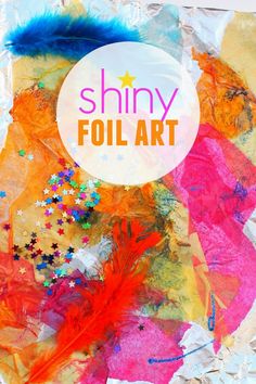 an art project made with tissue paper and colorful feathers on top of it, that says shiny