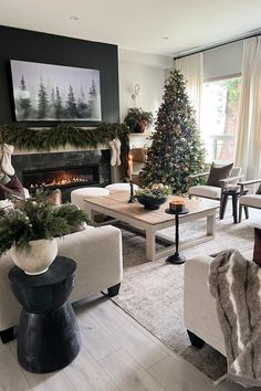 a living room filled with furniture and a christmas tree in the middle of the room