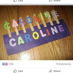 the name caroline spelled with wooden letters on a purple piece of paper that says caroline