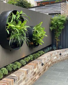 a wall mounted planter on the side of a building