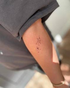 a person with a small tattoo on their arm