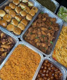 several trays filled with different types of food including burgers, sides and other foods