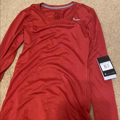 Brand New Nike Tee Nike Casual Top In University Red, Red Athleisure Top For Fall, Nike Workout Tops For Fall, Nike Sporty Tops In University Red, Nike Sporty University Red Tops, Nike Red Sporty Tops, Nike Sporty Red Top, Red Long Sleeve Athleisure Top, Nike Tops For Sports In Fall