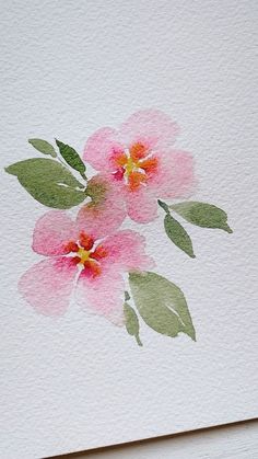 watercolor painting of pink flowers on white paper