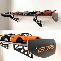 there are two shelves that have cars on top of each shelf and one has a sign reading gts