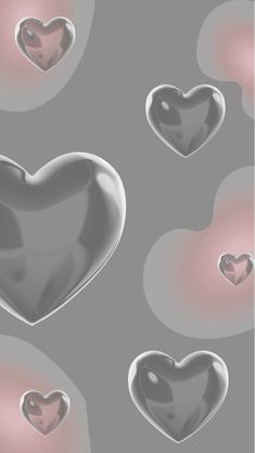 three hearts are shown in the middle of an image with pink and grey colors on it