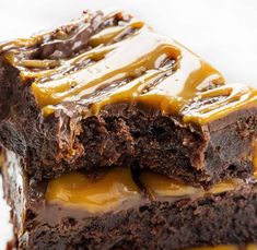 two pieces of chocolate cake with caramel drizzle on top