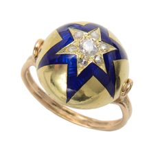 Exceptional conversion of an antique brooch into a very wearable and elegant ring. This bombe shaped 15KT. gold enamel and diamond star is the perfect centerpiece for this ring. Handcrafted modern 14KT. polished gold split wire shank is finished with simplicity and detail on its shoulders with 2 open wire teardrops. The star is set with 7 Old Euro Diamonds (approx. .65 Cts) which sparkle and catch the light from every angle. Size 6.5 but can be easily resized. Blue Star Sapphire Ring, Blue Star Sapphire, Antique Brooches, Star Sapphire, Diamond Star, Star Ring, Diamond Rings Bands, Elegant Ring, Gold Enamel