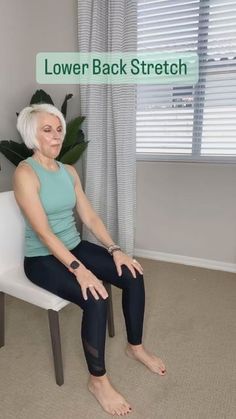 an older woman sitting on a white chair in front of a window with the words lower back stretch