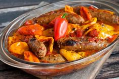 a glass dish filled with meat and vegetables