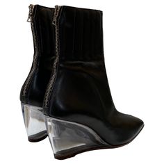 Vintage Courreges black leather ankle boot features special plexiglass wedge heel. Sturdy back zipper. Vintage Courreges, Wedge Heel Shoes, Shoes Heels Wedges, Black Leather Ankle Boots, Women Boots, Crazy Shoes, Wedge Boots, Leather Ankle Boots, Heel Shoes