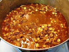 a large pot filled with lots of food on top of a stove