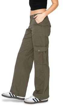 98% Cotton, 2% Spandex Feature: Elevate your wardrobe with our low-rise pants, featuring cargo side pockets adorned with webbing trim for a touch of style, a full-length relaxed fit for ultimate comfort, and bungee cords at the waist and ankle cuffs to ensure a perfect fit. Designed with an eye for style and a mind for functionality, these pants are your go-to for achieving a relaxed yet sophisticated look, whether you're at work or enjoying your downtime. Versatile Style: Create effortlessly ch Y2k Cargo Pants, New Y2k, Bungee Cords, Low Rise Pants, Green Cargo Pants, Bdg Urban Outfitters, Women Cargos, Casual Sporty, Ankle Cuffs