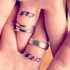 two people with matching rings on their fingers