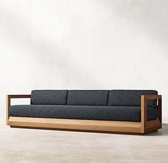 a couch sitting on top of a wooden frame