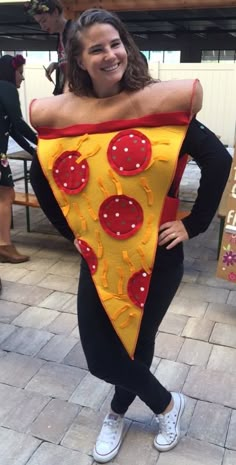 a woman wearing a costume made to look like a slice of pizza