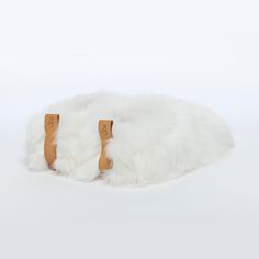 These Pearl white beauties are so precious they will be the most valuable item in your jewelry box. We mean your shoe collection. ETHICAL ALPACA FUR• Suri Description Slip with ease into the world's softest slippers. Baboosha Alpaca fur slippers deliver the perfect blend of style, elegance, and glamour of high fashion. Our luxury slippers are made for comfort both inside and outside the home. We use a thick vegetan leather sole and the finest Alpaca fur in the world, sourced ethically and cruelt Alpaca Slippers, Luxury Slippers, Suri Alpaca, Soft Slippers, Fashion Slippers, Designer Slippers, Fur Slippers, Boots Heels, Material Design