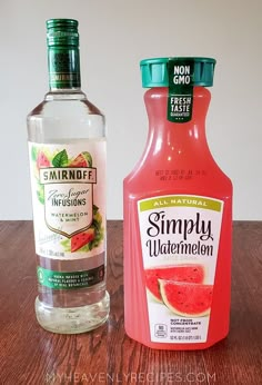 two bottles of watermelon juice and a bottle of gin on a wooden table