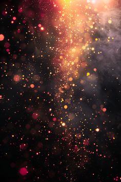 an abstract background with blurry lights and stars