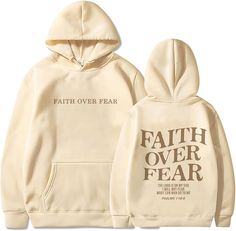 a white sweatshirt with the words faith over fear printed on it