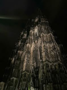 a very tall cathedral lit up at night