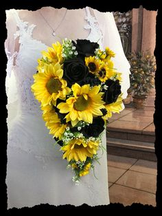 a bride holding a bouquet of sunflowers on her wedding day at the church