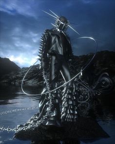 a man with chains and spikes on his head is standing in the middle of water